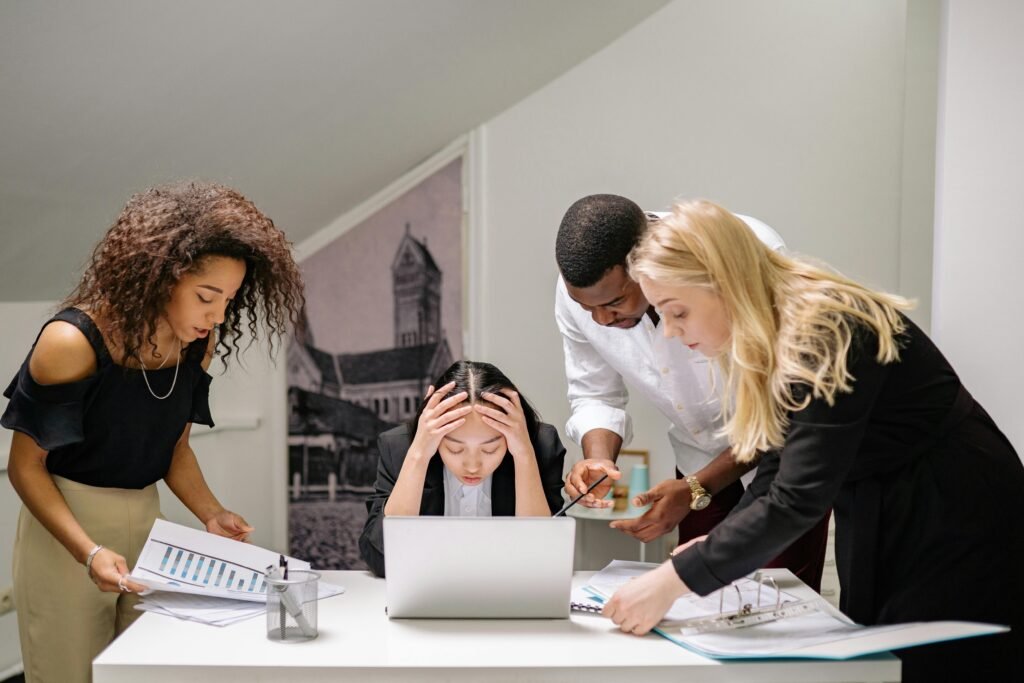 Four professionals resolving a disagreement