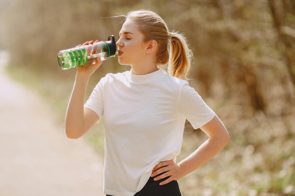 Woman drinking water in the morning for a healthy daily routine